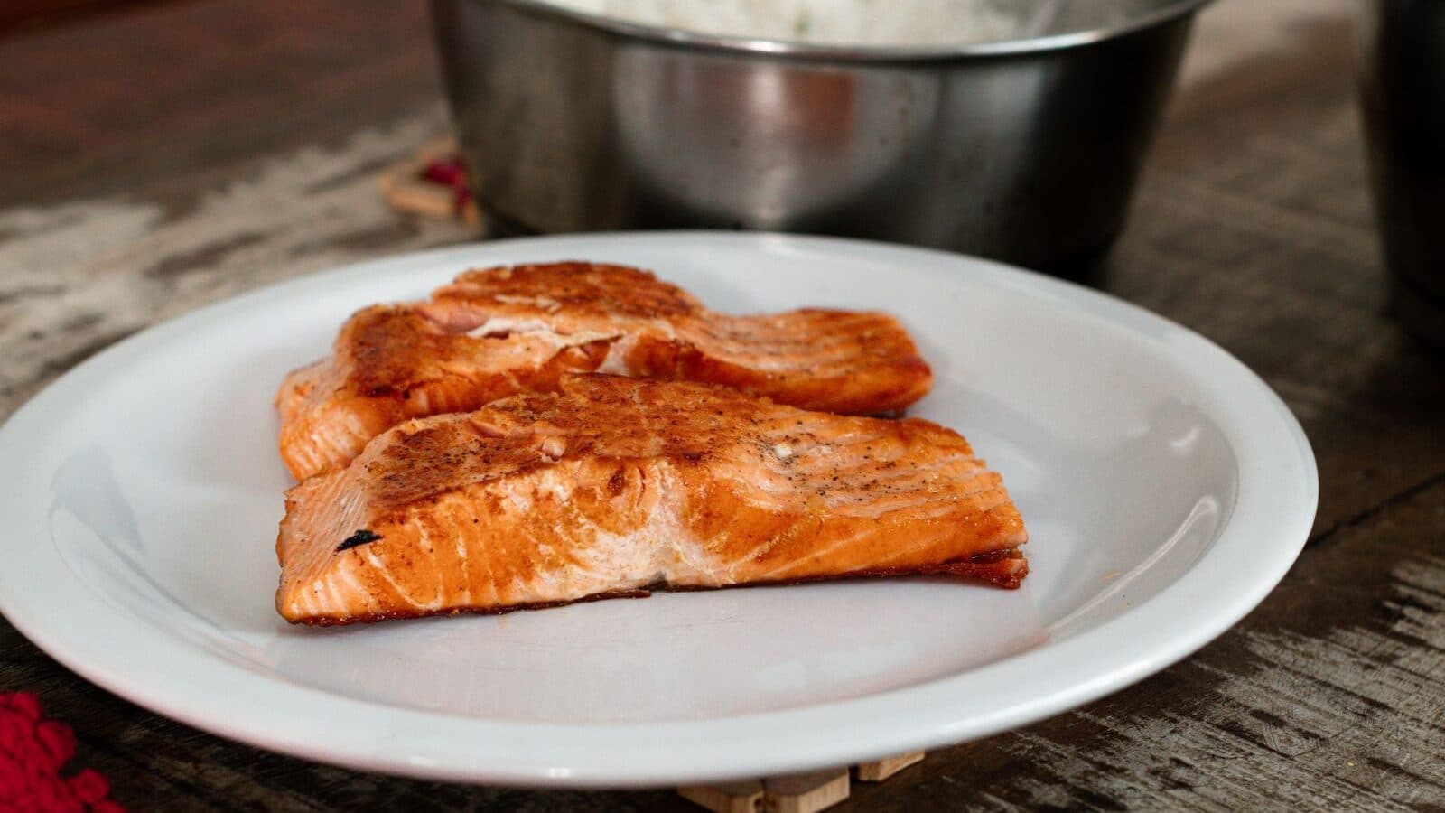 Cooked salmon fillets on a white plate