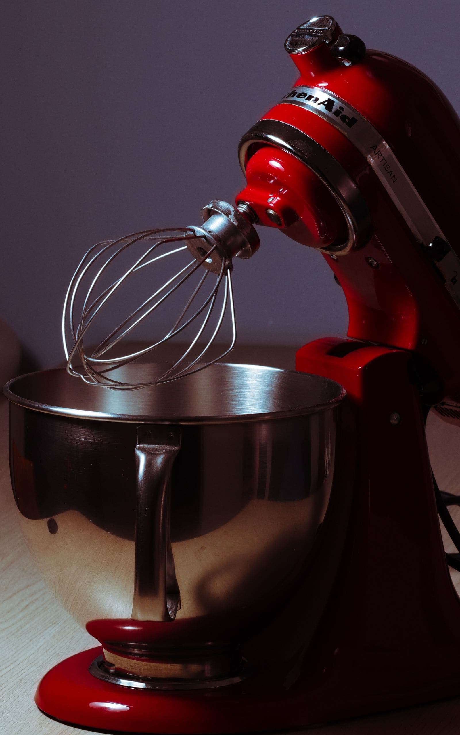 Close-up of a wire whip and flat beater on a stand mixer